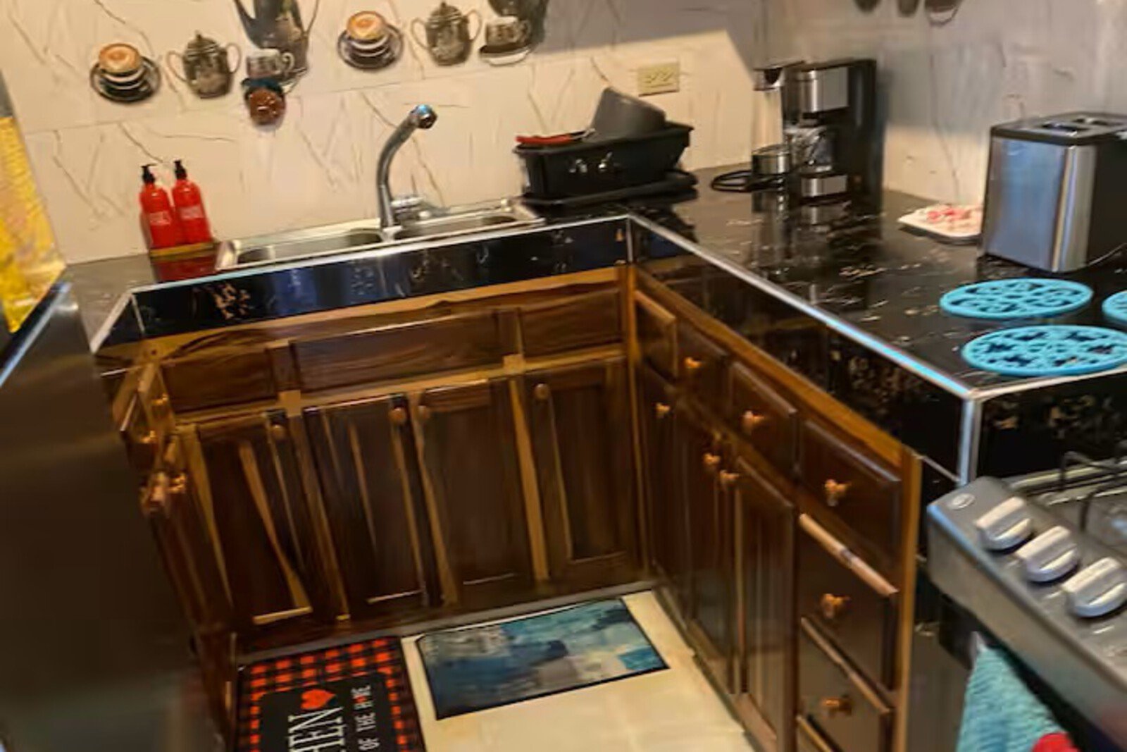 Modern kitchen in BayPalace villa with island seating and colorful accent decor.