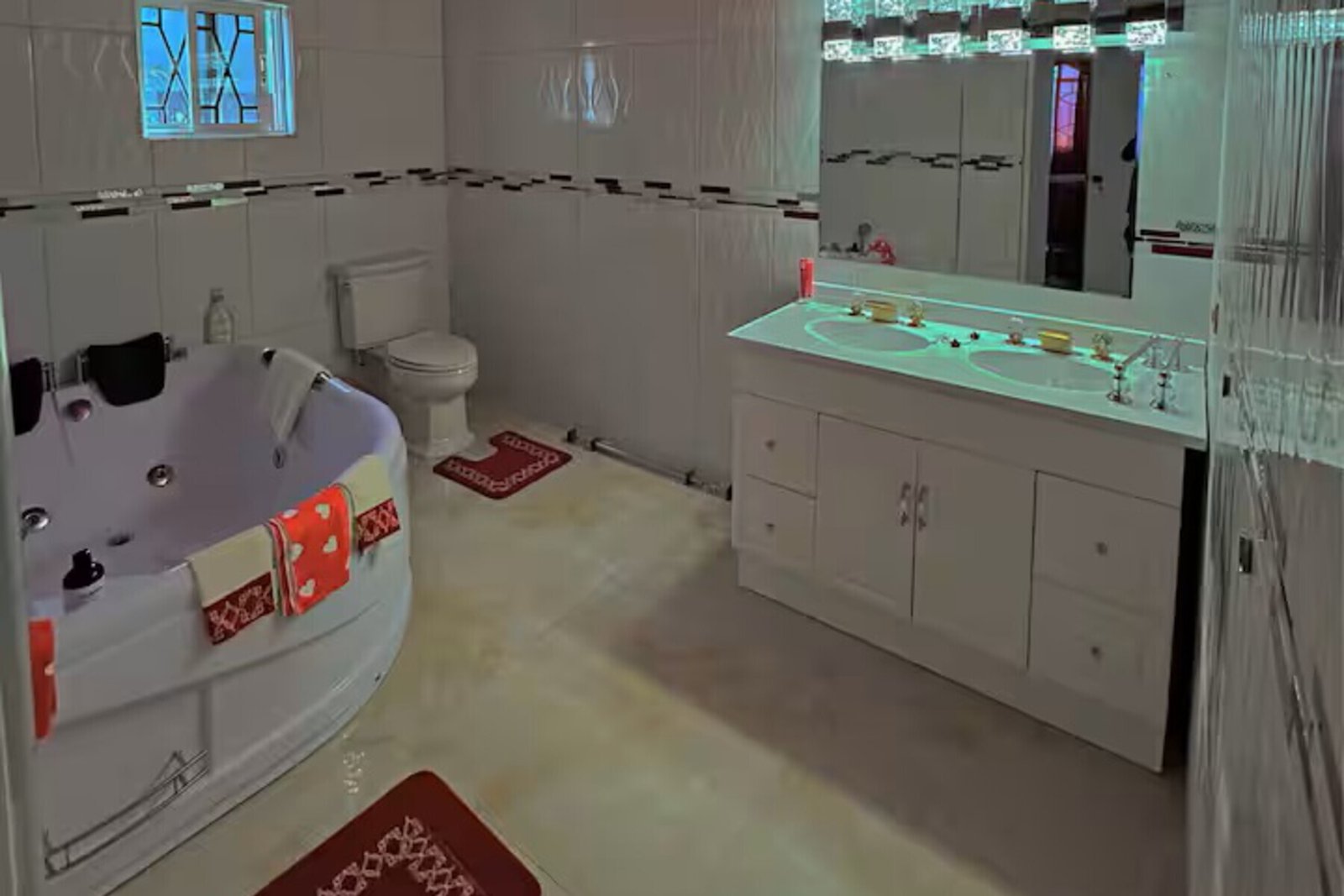 Aerial drone view showing the villa's quarter-acre property, pool, and lush gardens.